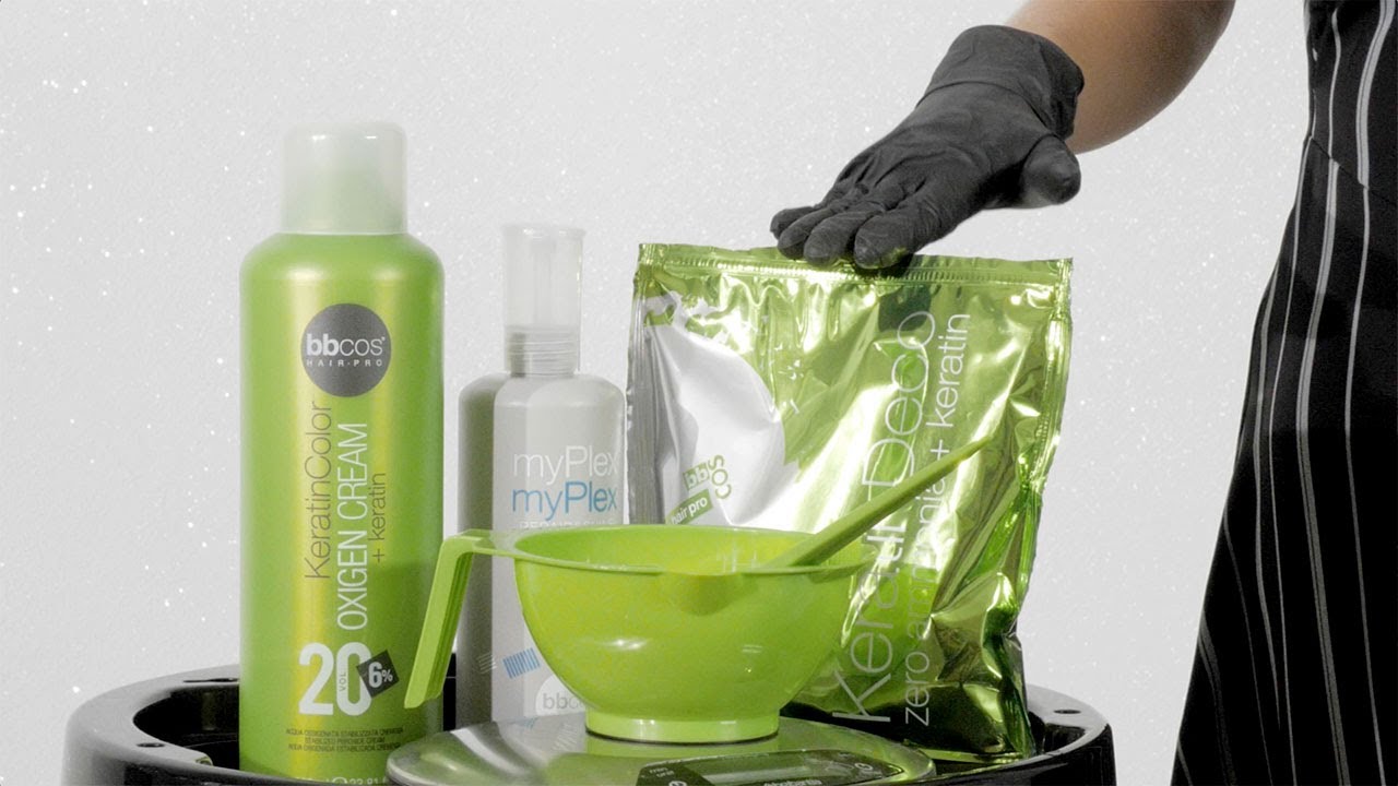 BBCOS Hair Pro keratin color and oxygen cream bottles with a mixing bowl and brush on a salon trolley